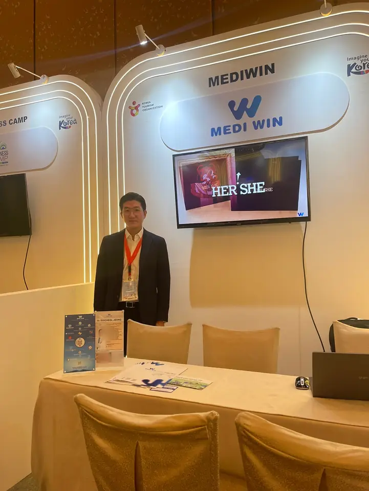 MEDIWIN CEO at the MEDIWIN booth at an international medical tourism event